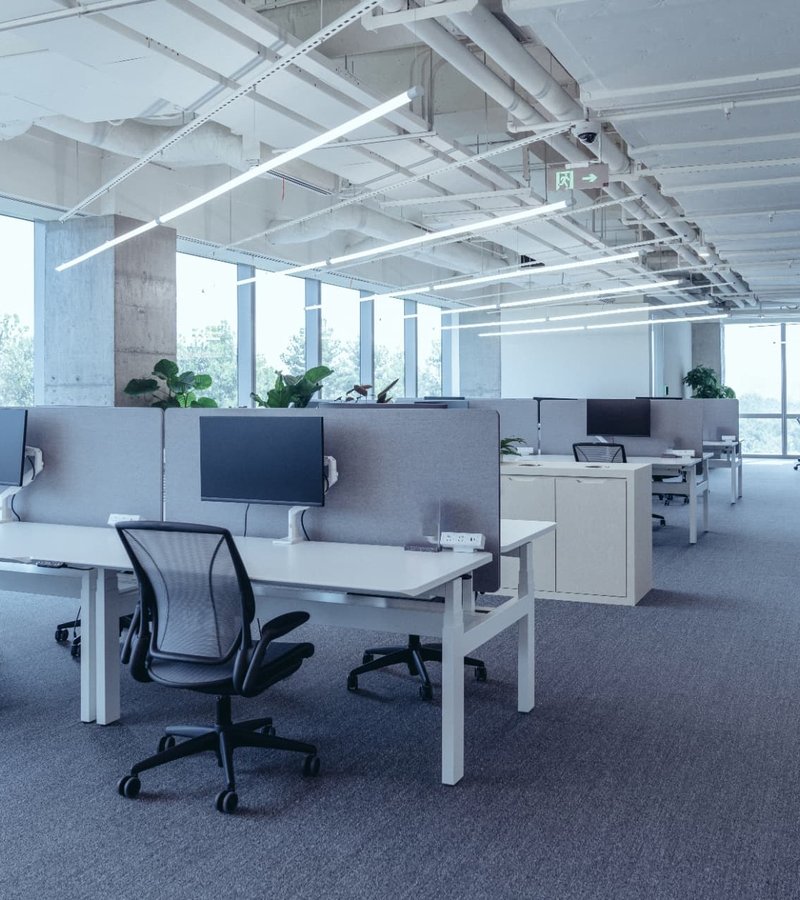 Desk with an ergonomic task lamp and daylight from a window